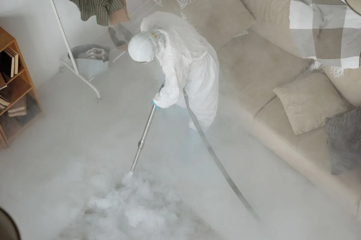 Biohazard cleanup technician in protective equipment, Wurtsboro Hills, NY